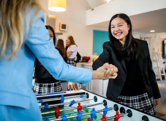 New House boarders shaking hands after a game of Table Football