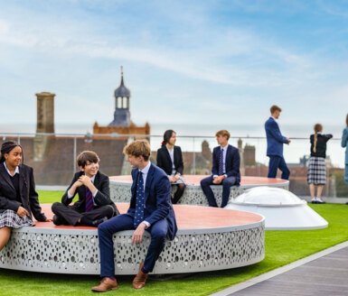  Sixth Form pupils talking to younger pupils in the Sky Garden on the roof of SSS 