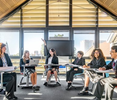  Pupils sitting in a circle with their teacher in a Religious Studies lesson in the Creative Learning Centre 