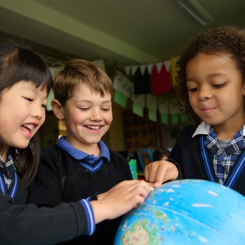  Pre-Prep pupils using a globe to help them learn in a Geography lesson 