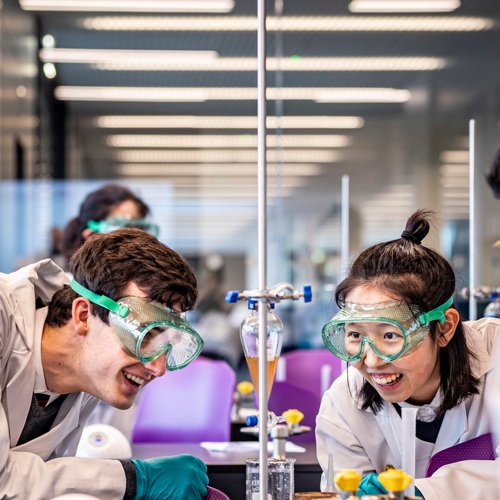  Pupils in a Chemistry lesson enjoying a titration experiment 